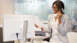 a woman having a phone call by the working desk