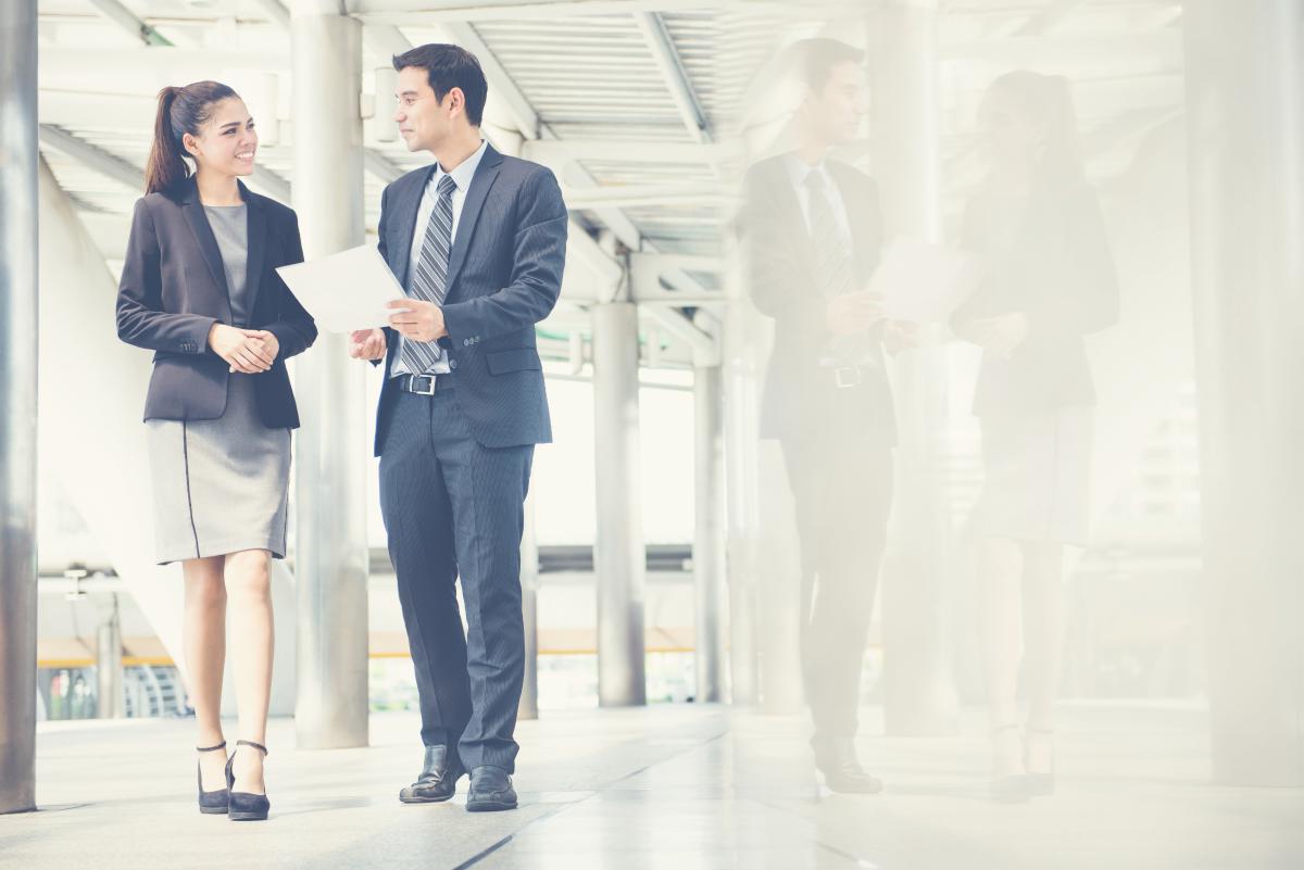 business people discussing work while walking | Tips To Build A Successful Sales Strategy Plan | sales strategy | how to be successful in sales