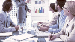 Young business people in board room meeting at the office